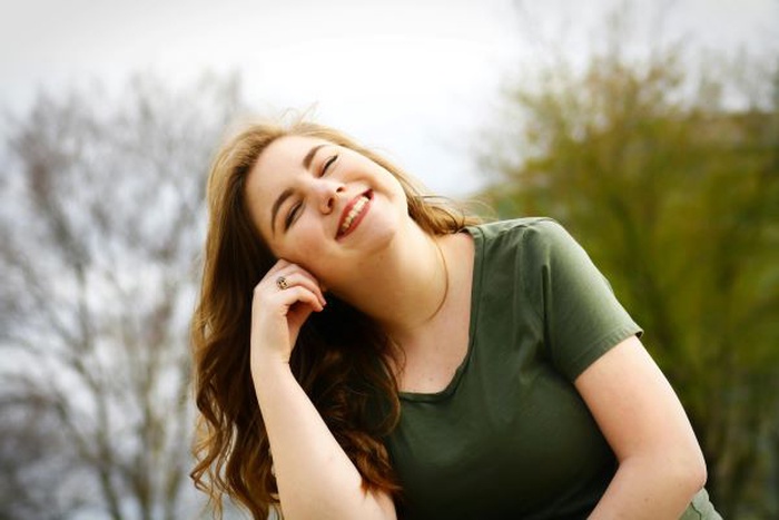 Smiling woman in green shirt