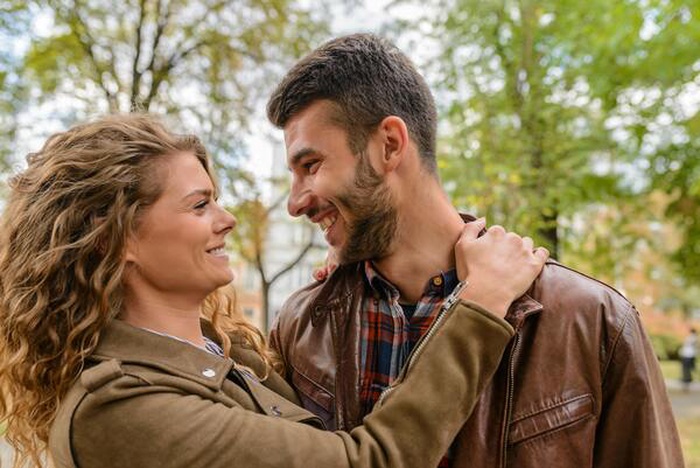 A couple looked at each other with a smile