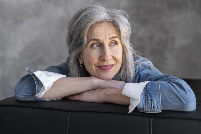 Portrait of smiling elegant senior woman